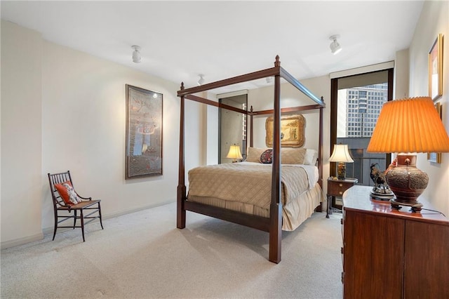 carpeted bedroom with baseboards