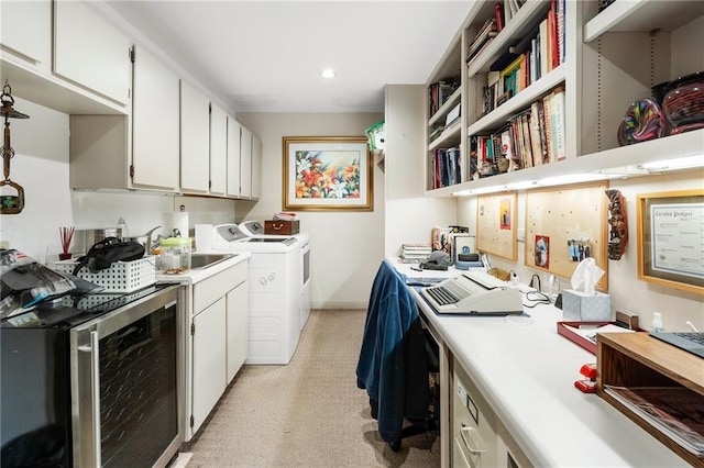 washroom featuring wine cooler, recessed lighting, a sink, separate washer and dryer, and laundry area
