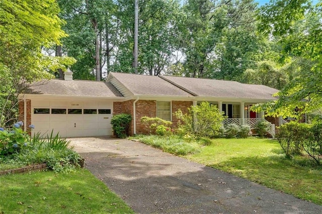 1618 Mason Mill Rd NE, Atlanta, GA 30329 - single story home featuring a garage, a front lawn, driveway, brick siding, and a shingled roof