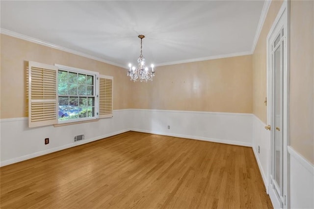 1618 Mason Mill Rd NE, Atlanta, GA 30329 - spare room featuring light wood finished floors, a chandelier, and ornamental molding
