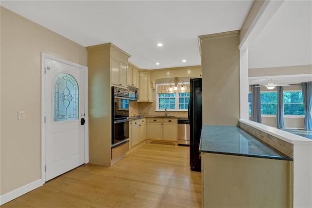 1618 Mason Mill Rd NE, Atlanta, GA 30329 - kitchen with black appliances, light wood-type flooring, healthy amount of natural light, and recessed lighting