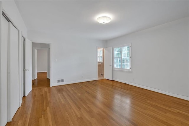 1618 Mason Mill Rd NE, Atlanta, GA 30329 - unfurnished bedroom featuring light wood-style flooring and baseboards