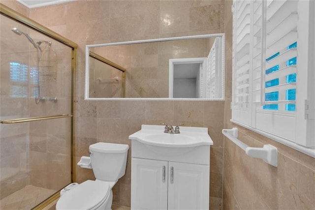 1618 Mason Mill Rd NE, Atlanta, GA 30329 - bathroom with tile walls, a stall shower, and vanity