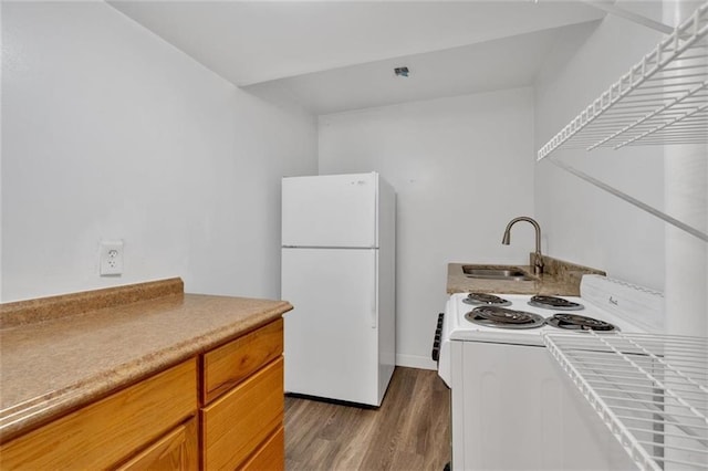 1618 Mason Mill Rd NE, Atlanta, GA 30329 - kitchen featuring white appliances, dark wood-type flooring, light countertops, and brown cabinetry