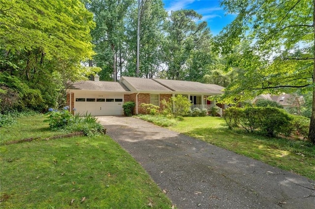 1618 Mason Mill Rd NE, Atlanta, GA 30329 - ranch-style home with driveway, an attached garage, a front yard, a chimney, and brick siding