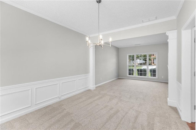 7000 Foxberry Ln, Roswell, GA 30075 - empty room featuring ornamental molding, a textured ceiling, a chandelier, wainscoting, and carpet