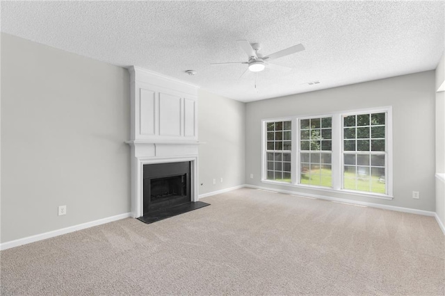 7000 Foxberry Ln, Roswell, GA 30075 - unfurnished living room with a ceiling fan, carpet floors, a textured ceiling, and a large fireplace