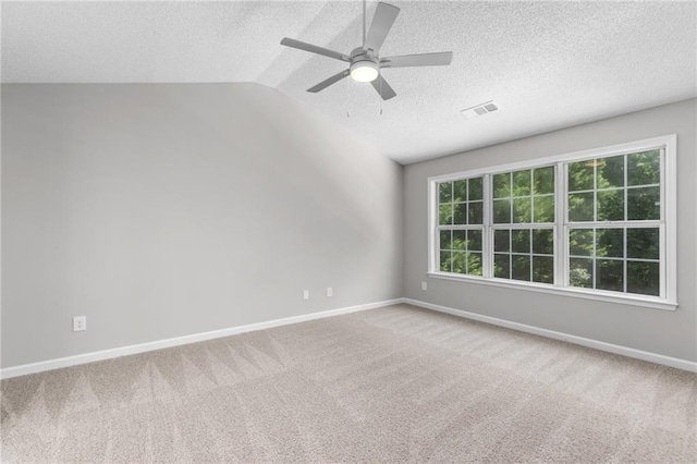 7000 Foxberry Ln, Roswell, GA 30075 - carpeted empty room featuring a textured ceiling, a ceiling fan, and lofted ceiling