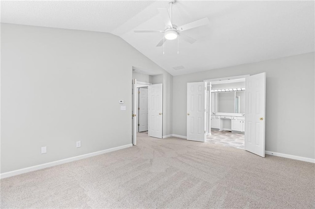 7000 Foxberry Ln, Roswell, GA 30075 - unfurnished bedroom featuring light colored carpet, lofted ceiling, ensuite bathroom, and a ceiling fan