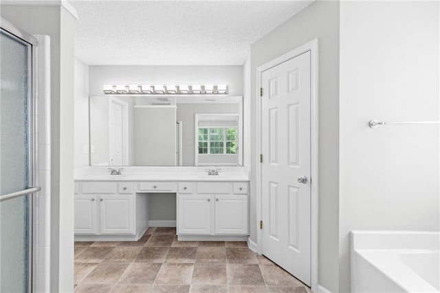 7000 Foxberry Ln, Roswell, GA 30075 - full bathroom featuring double vanity, a stall shower, a garden tub, and a textured ceiling