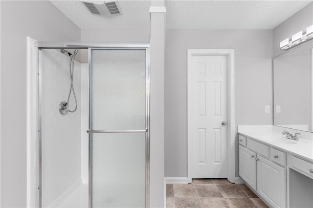 7000 Foxberry Ln, Roswell, GA 30075 - bathroom featuring vanity, a shower stall, and a textured ceiling