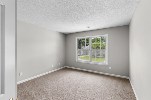 7000 Foxberry Ln, Roswell, GA 30075 - carpeted empty room with a textured ceiling and baseboards