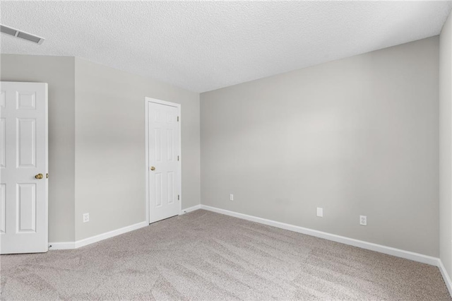 7000 Foxberry Ln, Roswell, GA 30075 - unfurnished bedroom featuring carpet floors and a textured ceiling