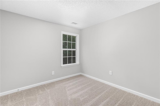 7000 Foxberry Ln, Roswell, GA 30075 - carpeted spare room featuring baseboards and a textured ceiling