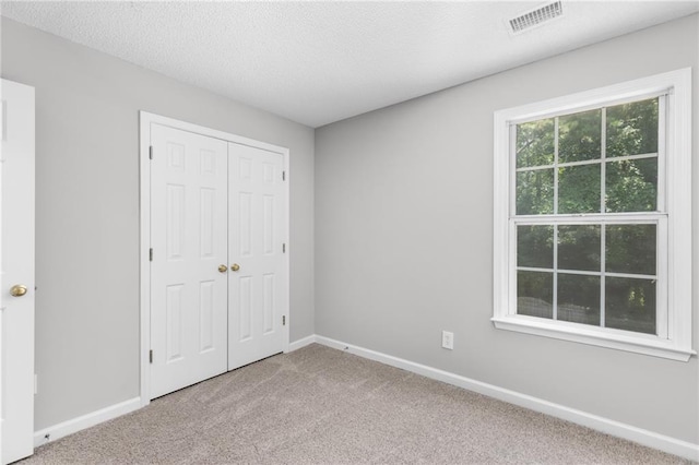 7000 Foxberry Ln, Roswell, GA 30075 - unfurnished bedroom featuring carpet flooring and a closet