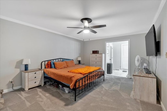 carpeted bedroom featuring connected bathroom, ceiling fan, and ornamental molding