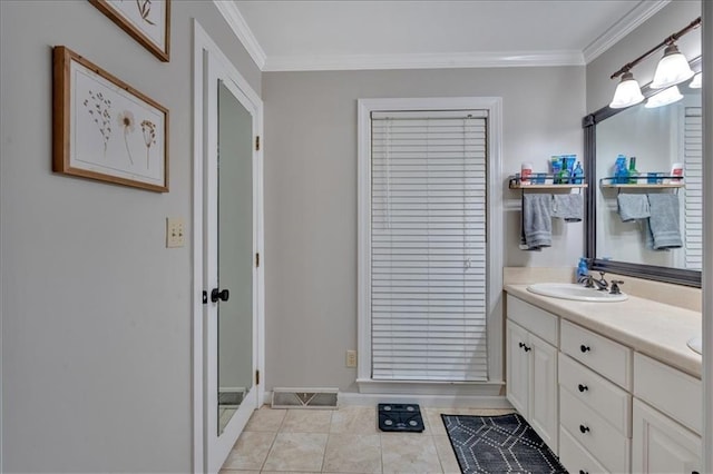 bathroom featuring tile patterned floors, vanity, and crown molding