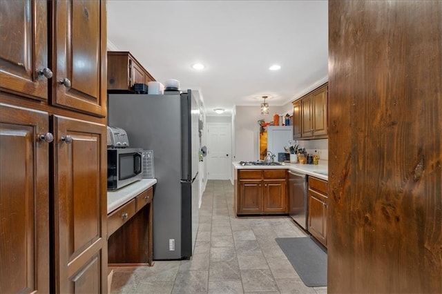 kitchen featuring kitchen peninsula and appliances with stainless steel finishes