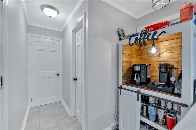 hallway with crown molding and light tile patterned floors