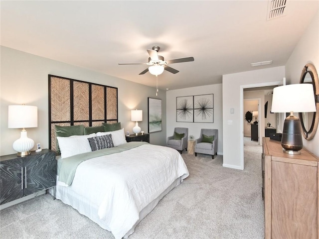 carpeted bedroom featuring visible vents, ceiling fan, and baseboards