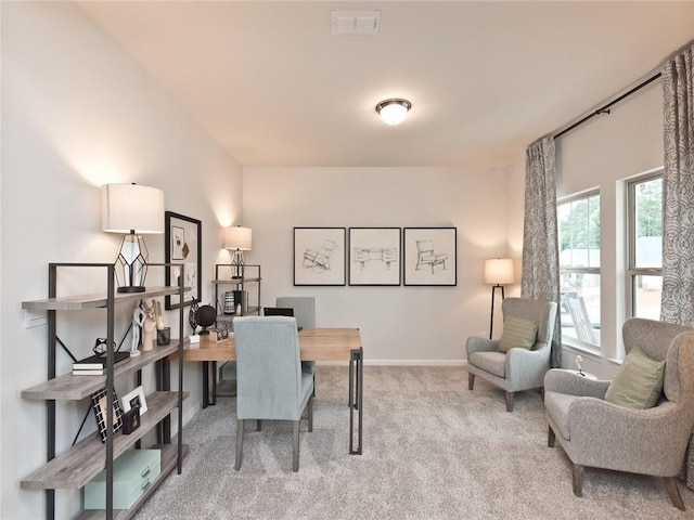 carpeted office featuring baseboards and visible vents