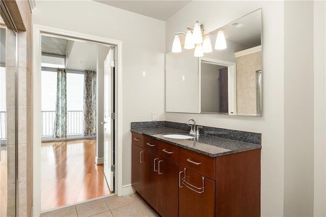 44 Peachtree Pl NE Unit 1824, Atlanta, GA 30309 - bathroom with vanity, tile patterned flooring, and a chandelier