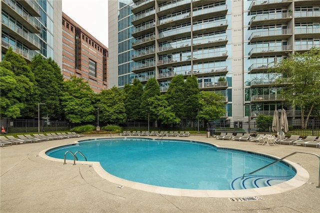44 Peachtree Pl NE Unit 1824, Atlanta, GA 30309 - community pool featuring a patio area