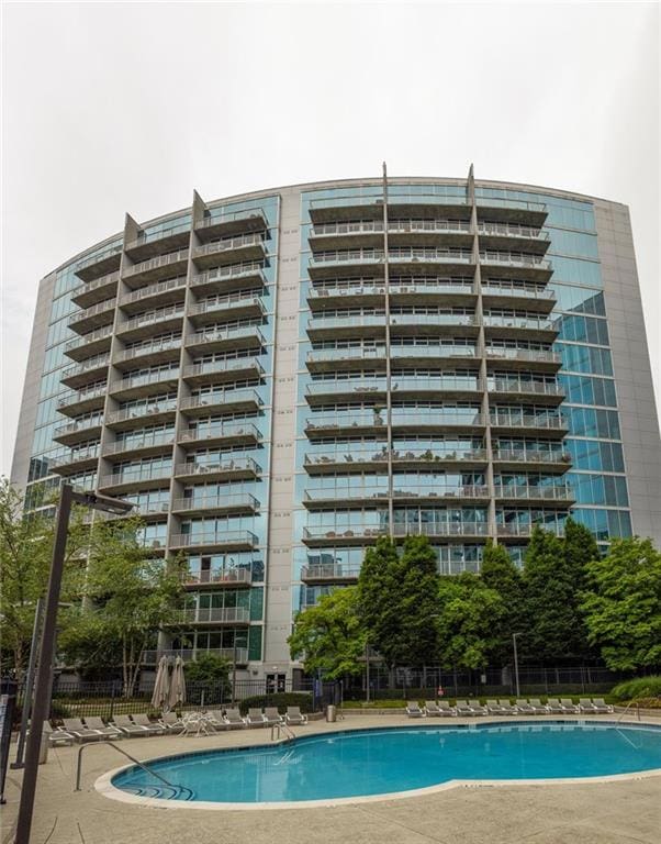 44 Peachtree Pl NE Unit 1824, Atlanta, GA 30309 - community pool with a patio