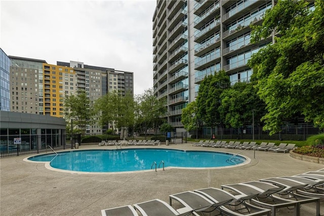 44 Peachtree Pl NE Unit 1824, Atlanta, GA 30309 - community pool featuring a patio