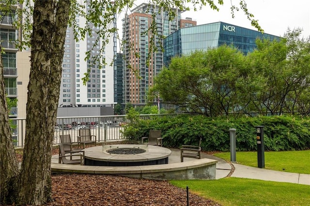 44 Peachtree Pl NE Unit 1824, Atlanta, GA 30309 - view of community featuring an outdoor fire pit and a patio area