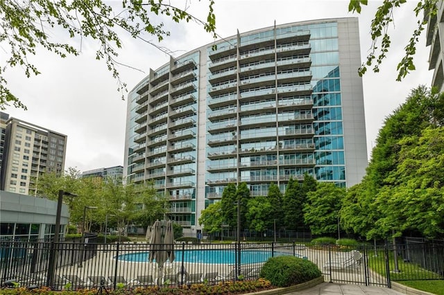 44 Peachtree Pl NE Unit 1824, Atlanta, GA 30309 - view of property featuring a community pool