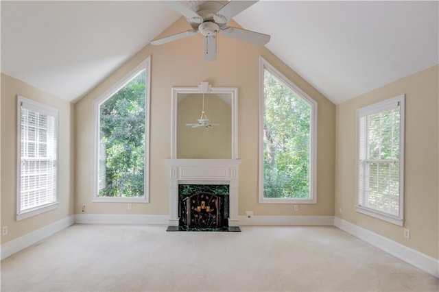 unfurnished living room with light carpet, vaulted ceiling, and ceiling fan