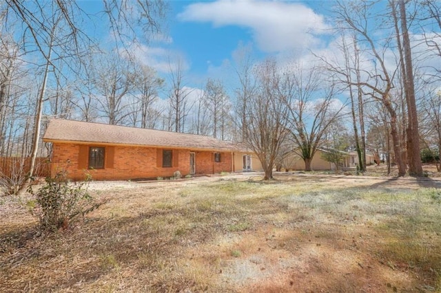 exterior space with brick siding