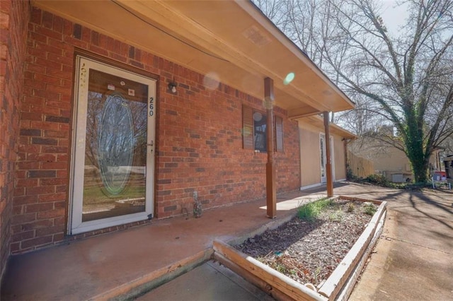 view of home's exterior with brick siding