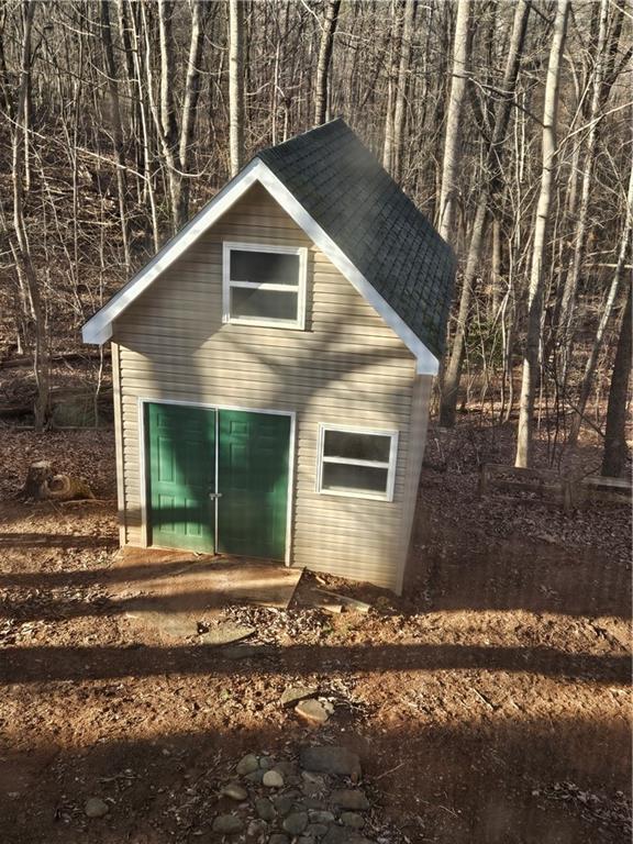 view of outbuilding featuring an outdoor structure