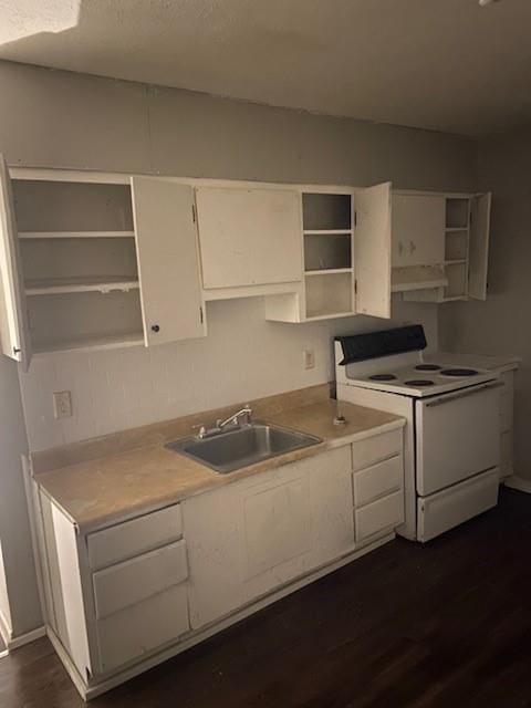 kitchen with a sink, open shelves, white cabinetry, and white range with electric stovetop