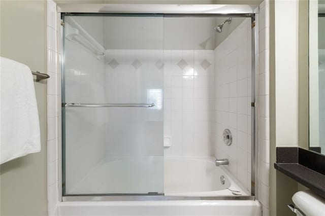 full bath featuring toilet and enclosed tub / shower combo