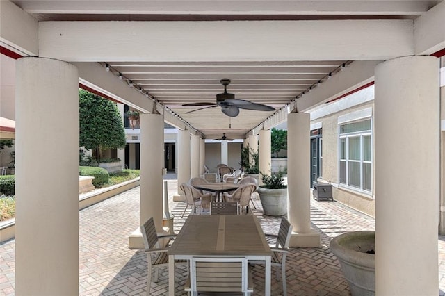 view of patio with outdoor dining area and ceiling fan