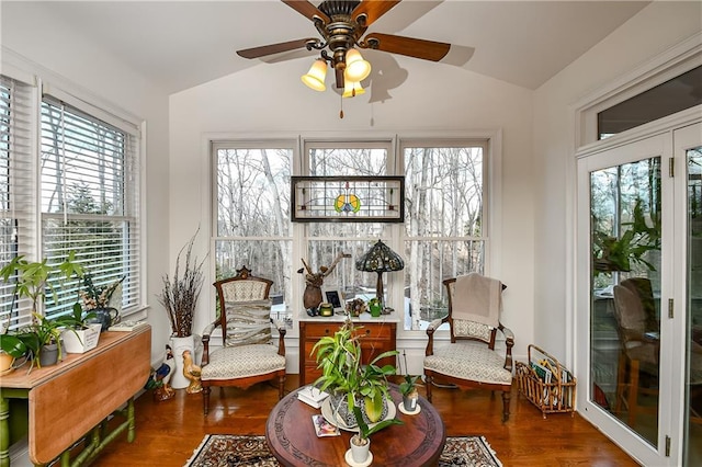 sunroom / solarium with lofted ceiling and ceiling fan