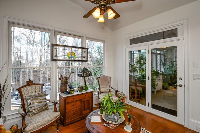 sunroom featuring ceiling fan