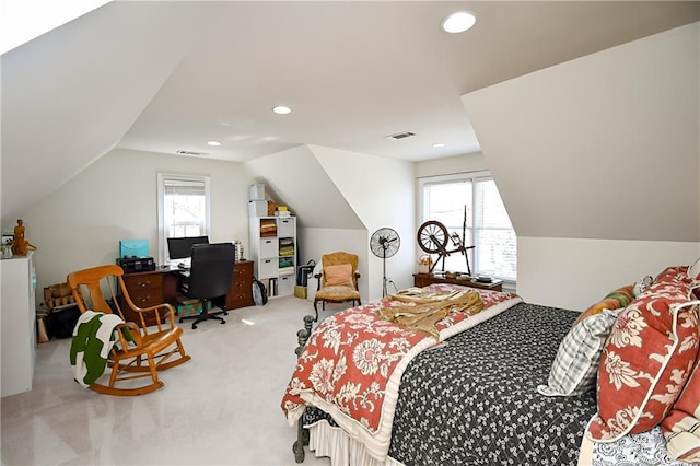 carpeted bedroom featuring multiple windows, recessed lighting, and visible vents