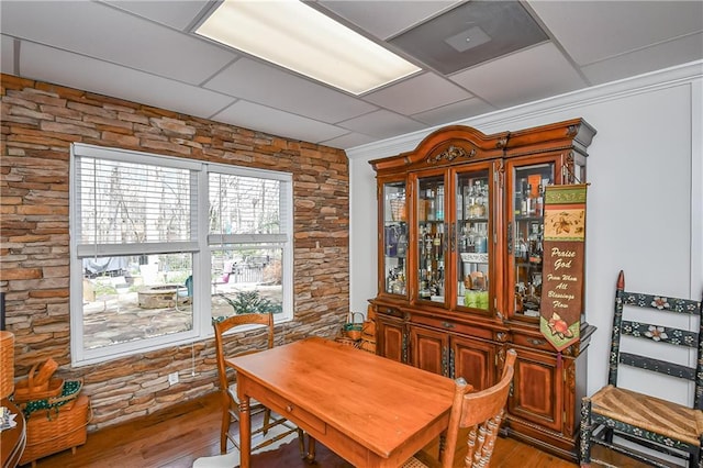 dining space with light wood-type flooring and ornamental molding