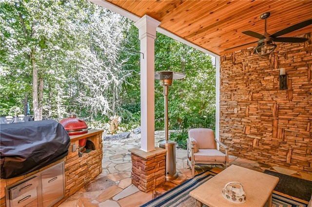 view of patio featuring grilling area, exterior kitchen, and ceiling fan