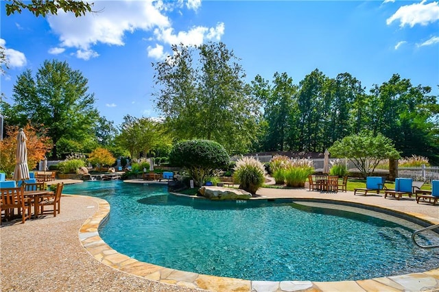 view of pool featuring fence, a patio, and a fenced in pool