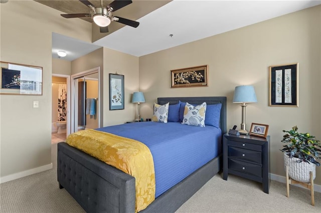 943 Peachtree St NE Unit 1910, Atlanta, GA 30309 - bedroom with carpet flooring, connected bathroom, a closet, a ceiling fan, and baseboards
