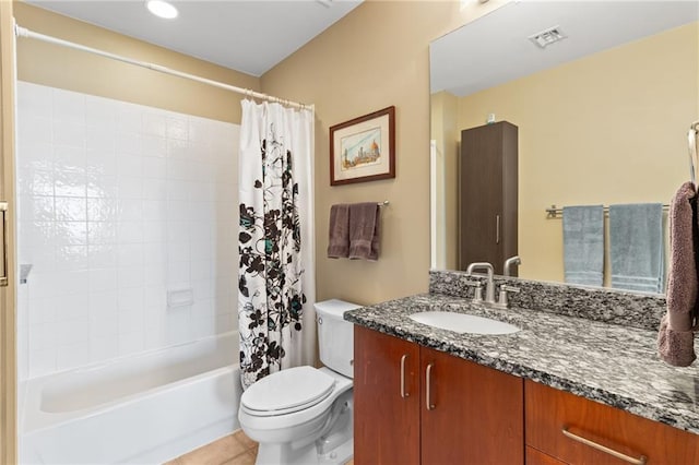 943 Peachtree St NE Unit 1910, Atlanta, GA 30309 - bathroom featuring tile patterned flooring, toilet, vanity, visible vents, and shower / tub combo with curtain