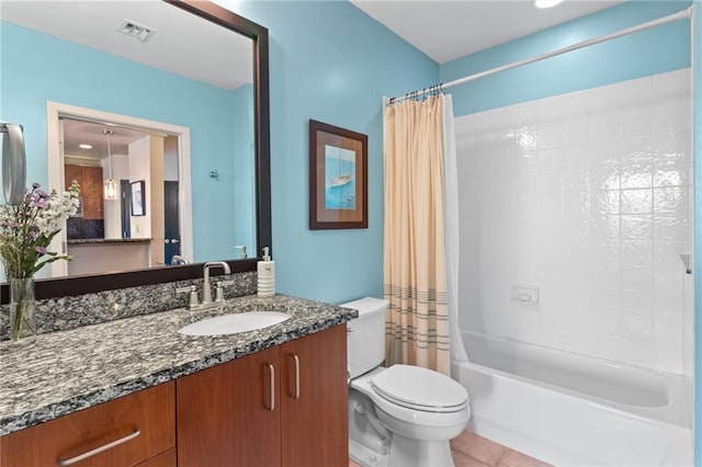 943 Peachtree St NE Unit 1910, Atlanta, GA 30309 - full bath with shower / tub combo, visible vents, toilet, vanity, and tile patterned flooring