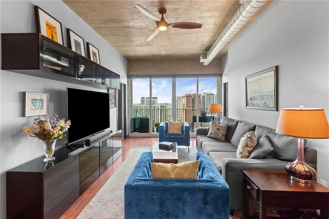 943 Peachtree St NE Unit 1910, Atlanta, GA 30309 - living area featuring a ceiling fan and light wood-style flooring
