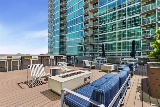 943 Peachtree St NE Unit 1910, Atlanta, GA 30309 - wooden terrace featuring an outdoor fire pit