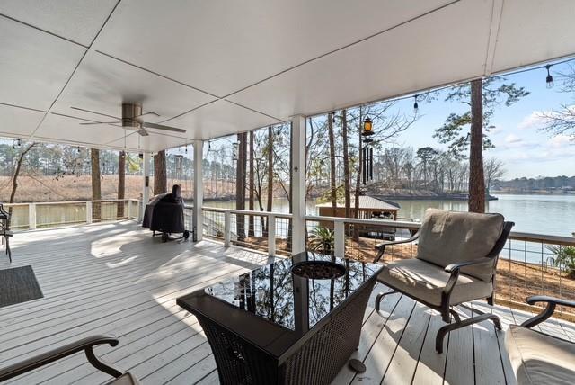 433 Dwain Ball Rd, Sparta, GA 31087 - wooden terrace with a ceiling fan, a water view, and a grill